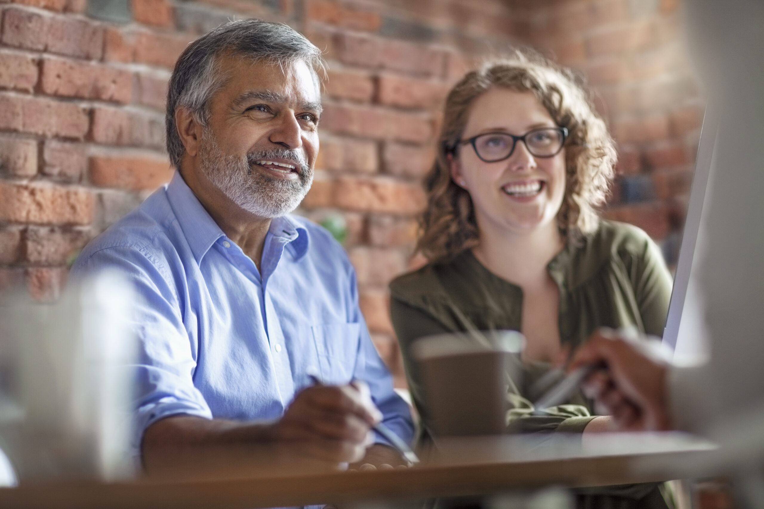 Adult man and female family member learning so they can make better financial decisions.